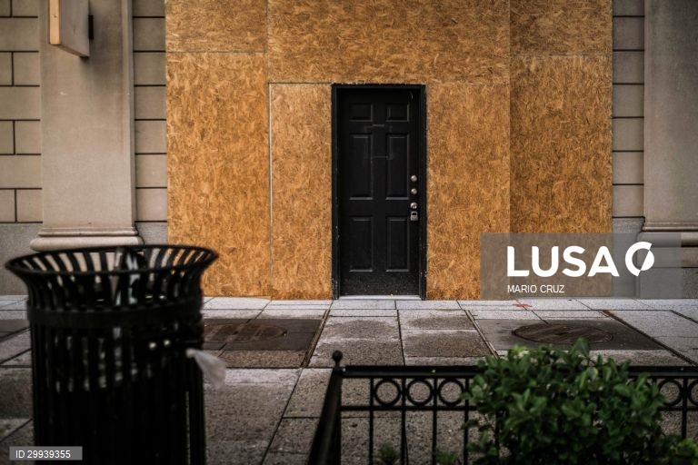 The entrance of a building is seen protected with wooden boards in Washington DC, United States, 01 November 2020 (issued on 02 November 2020). Downtown Washington DC meets commercial establishments protected by plywood boards for fear of "disturbances" after the release of the presidential election results and signs of protest from the "Black Lives Matter" movement near the White House railings where a demonstration is being prepared for election night. MARIO CRUZ/LUSA