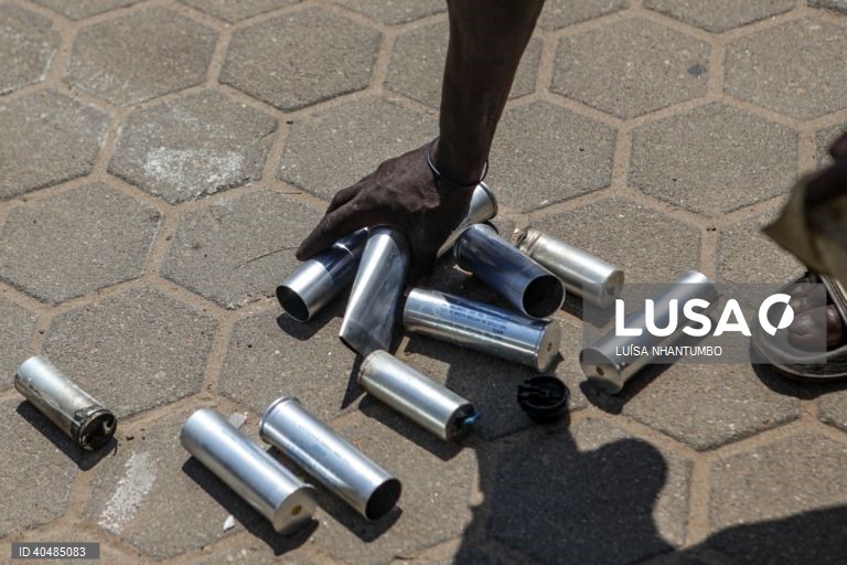 A citizen picks up tear gas canisters from the ground in the street of Maputo, 18 March 2023.Mozambican police are dispersing with tear gas a march in Maputo in honor of the social intervention 'rapper' Azagaia, who died a week ago from illness, Mozambique.. The organizers of the peaceful march in honor of the 'rapper' Azagaia, today repressed by the Mozambican police with tear gas in Maputo, say that the action of the authorities is proof that the Constitution does not work in the country....