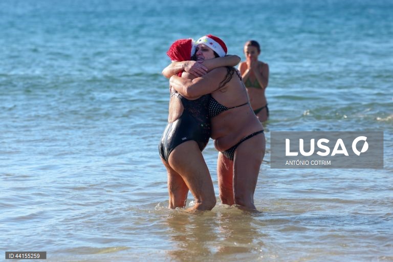 People take part in a traditional sea bath during the New Year's celebrations at Carcavelos beach in Cascais, near Lisbon, Portugal, 1 January 2025.  ANTÓNIO COTRIM/LUSA