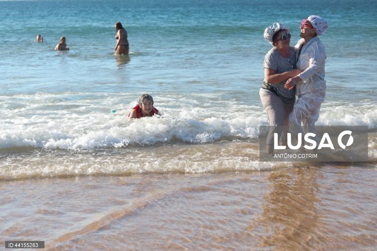 People take part in a traditional sea bath during the New Year's celebrations at Carcavelos beach in Cascais, near Lisbon, Portugal, 1 January 2025.  ANTÓNIO COTRIM/LUSA