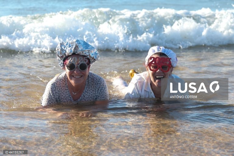 People take part in a traditional sea bath during the New Year's celebrations at Carcavelos beach in Cascais, near Lisbon, Portugal, 1 January 2025.  ANTÓNIO COTRIM/LUSA