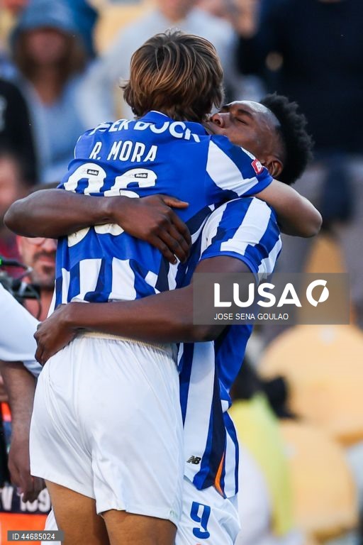 FC Porto player Rodrigo Mora (L) celebrates with his team mate Samu Aghehowa after scoring a goal during the First League soccer match between Estoril Praia and FC Porto, at Antonio Coimbra da Mota Stadium, in Estoril, Portugal, 30 May 2025. JOSE SENA GOULAO/LUSA