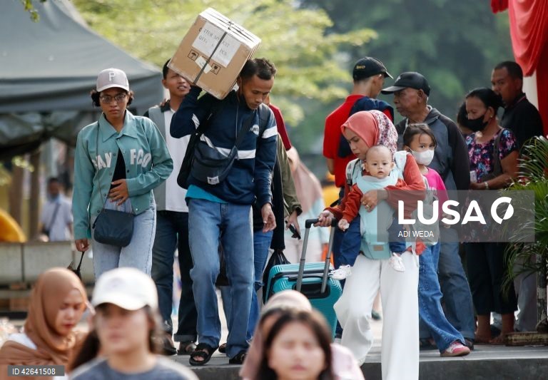 People leave for their hometowns ahead of Eid al-Fitr celebrations in Indonesia