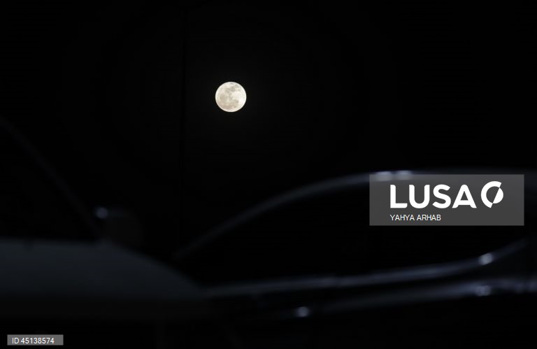 Junes full strawberry moon seen from Sanaa