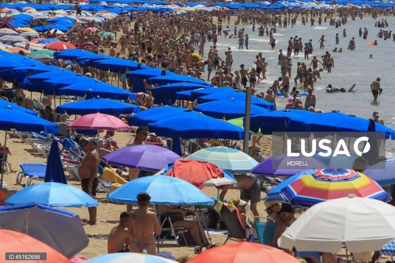 Sunbathers crowd Levante beach in Benidorm