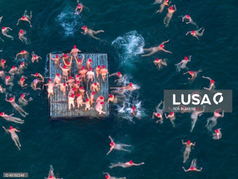 Nude swimmers join winter solstice tradition at Dark Mofo festival in Hobart

