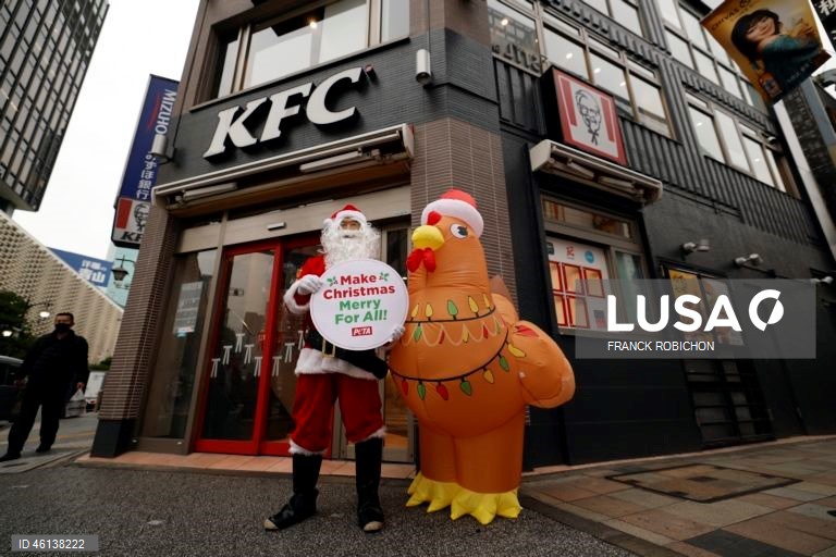 PETA animal rights activists protest outside KFC restaurant