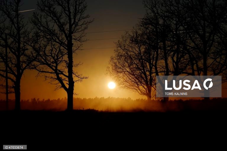 Sunset over a field in Latvia